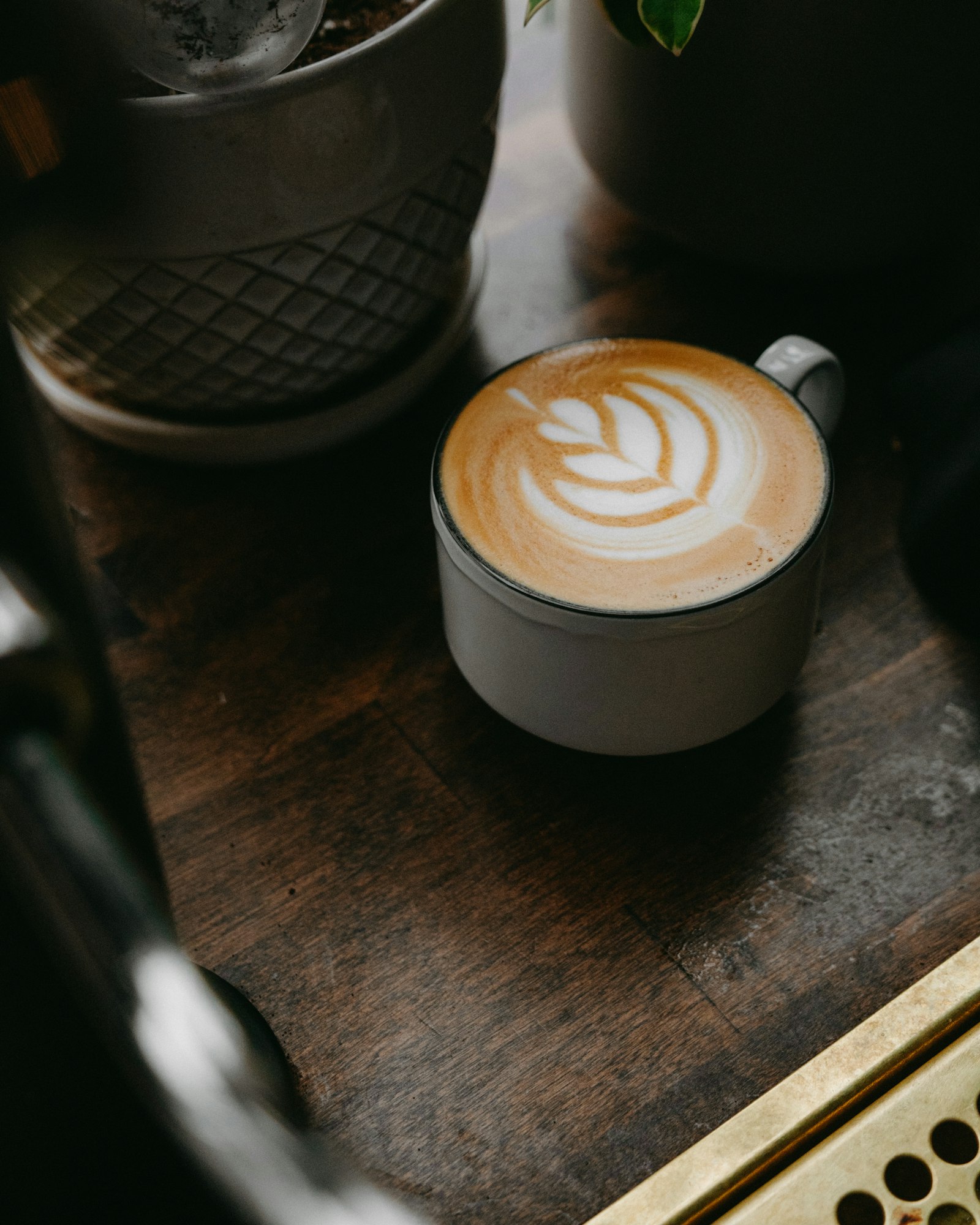 Cappuccino with latte art on a café counter